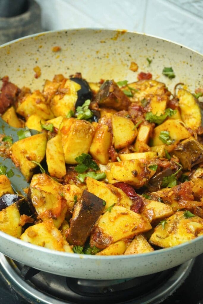 potato eggplant tomato cooking - potato eggplant curry - eggplant potato curry - Indian potato eggplant recipe - vegan potato eggplant curry