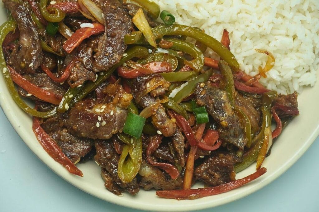 Beef Stir Fry serving with rice in bowl