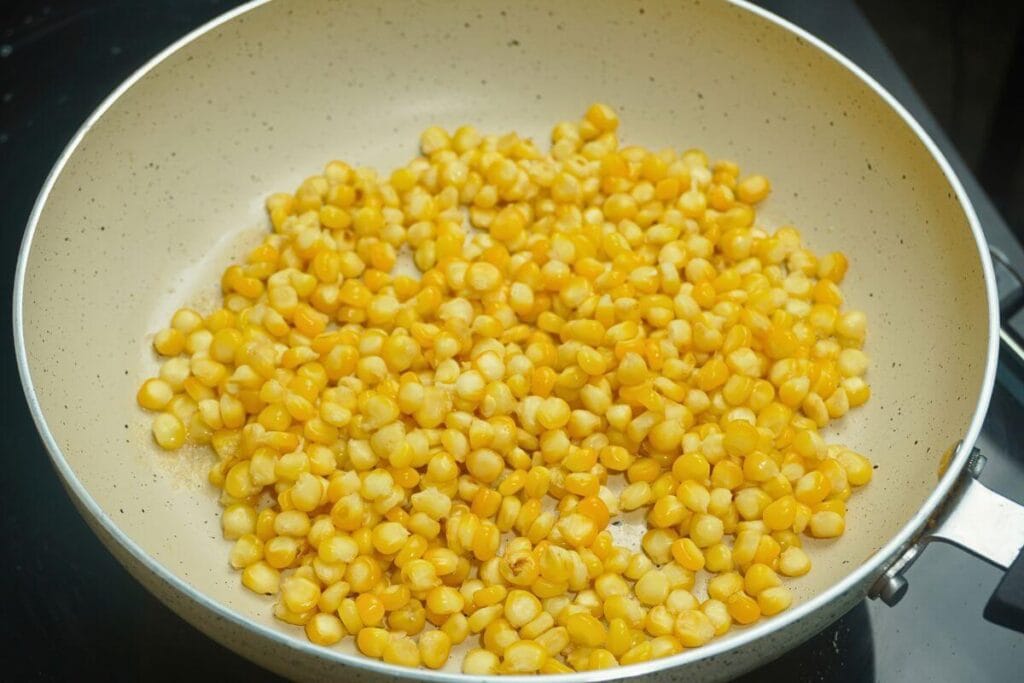 garlic butter masala corn added corn in pan