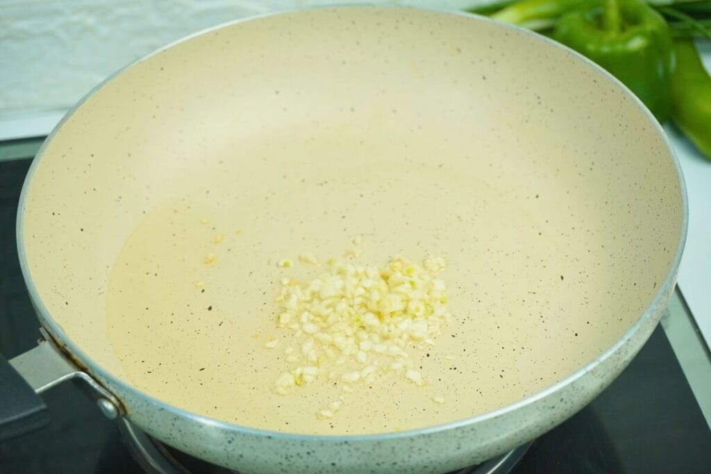 garlic in hot oil in pan