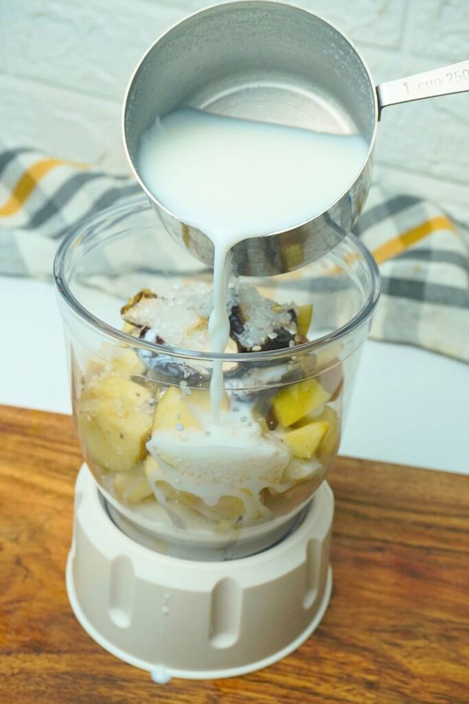 apple and banana smoothie add all ingreditns and milk in blender jar