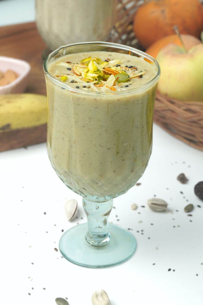 apple and banana smoothie in a glass
