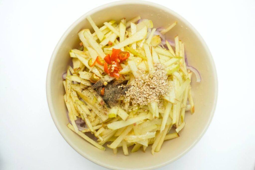 apple and onion salad add all ingredients