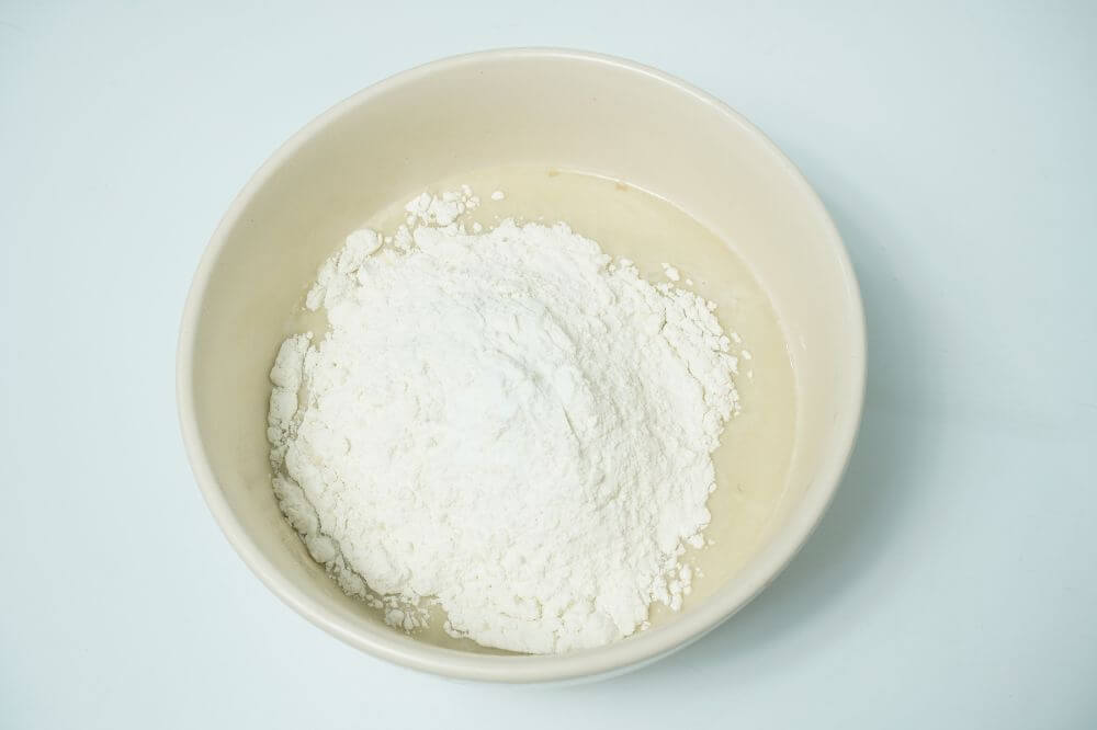 fluffy pancakes add flour in bowl