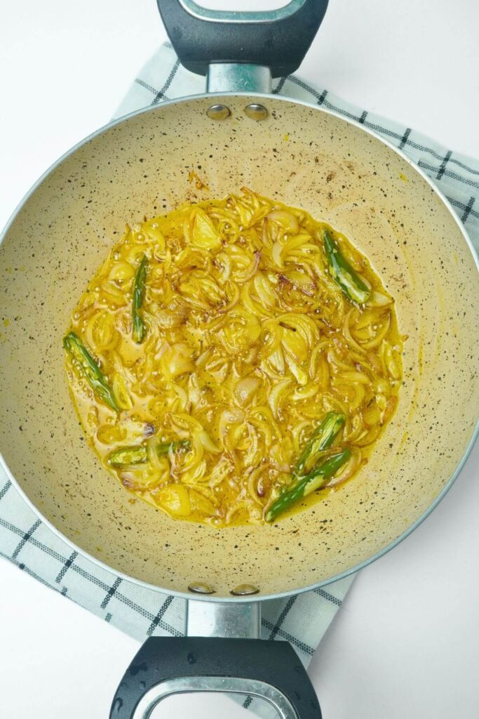 okra and potato stir fry saute onion and green chili