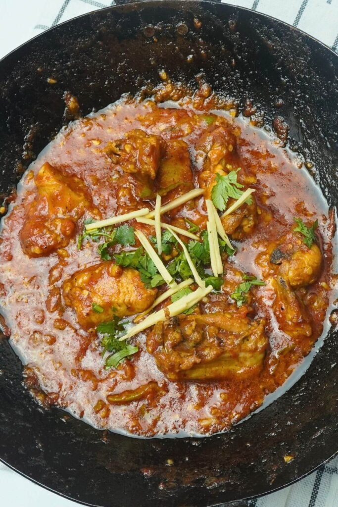 peshawari chicken karahi garnish with jullien ginger and fresh cilantro