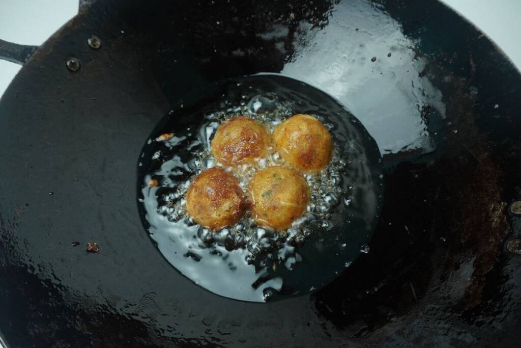 fried banana balls frying