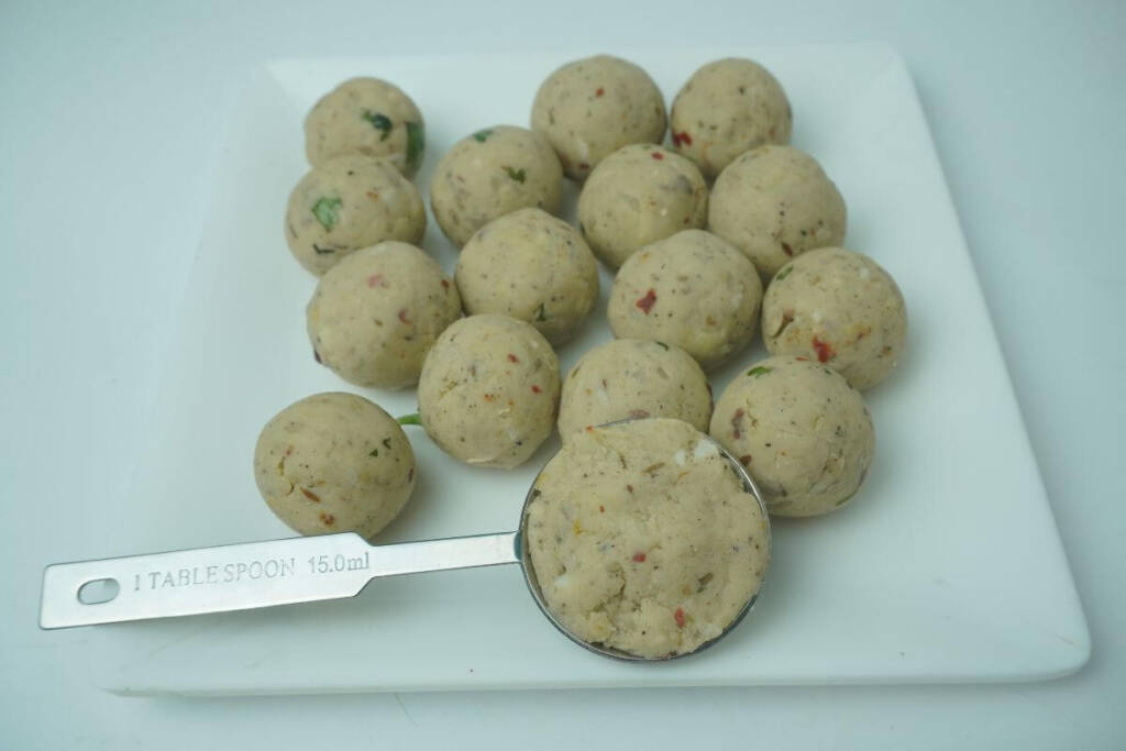 fried banana balls making balls using tablespoon