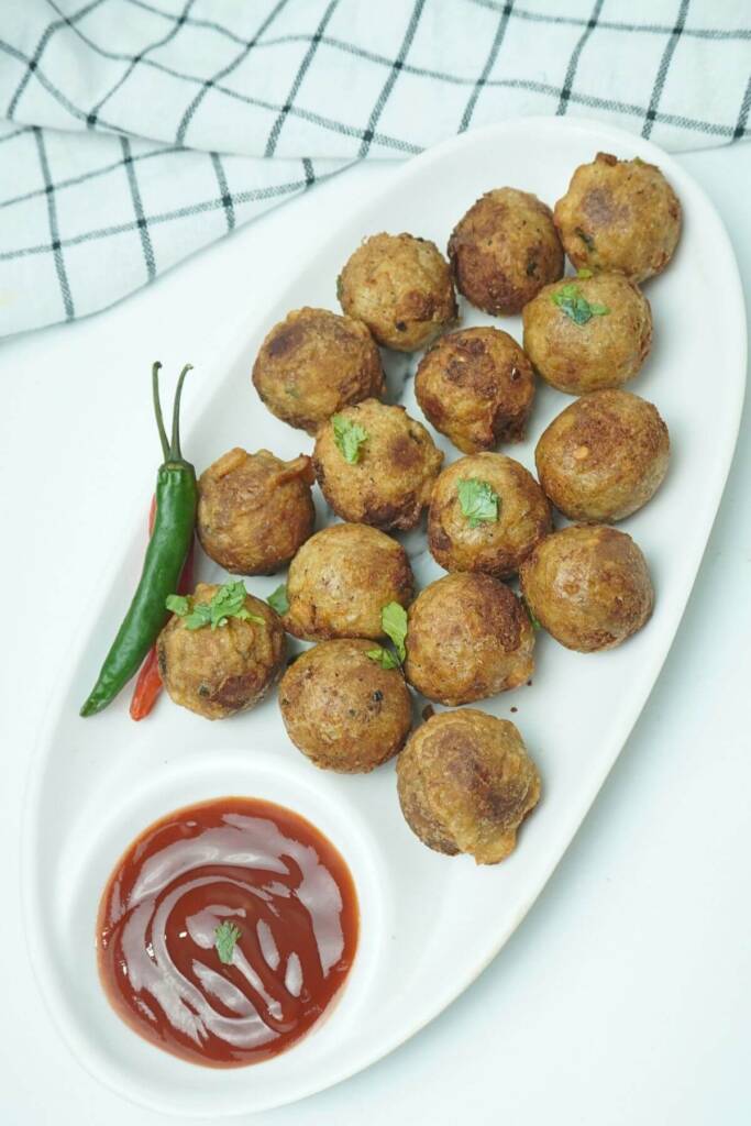 fried banana balls with tomato ketchup