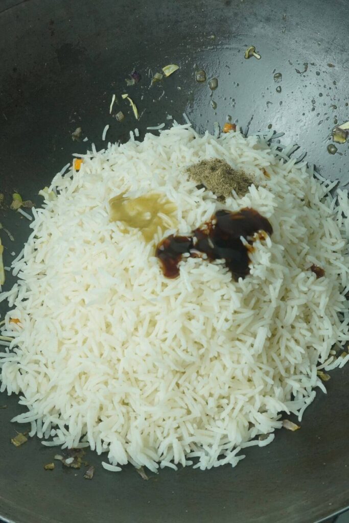 easy veg fried rice recipe add rice with other spices