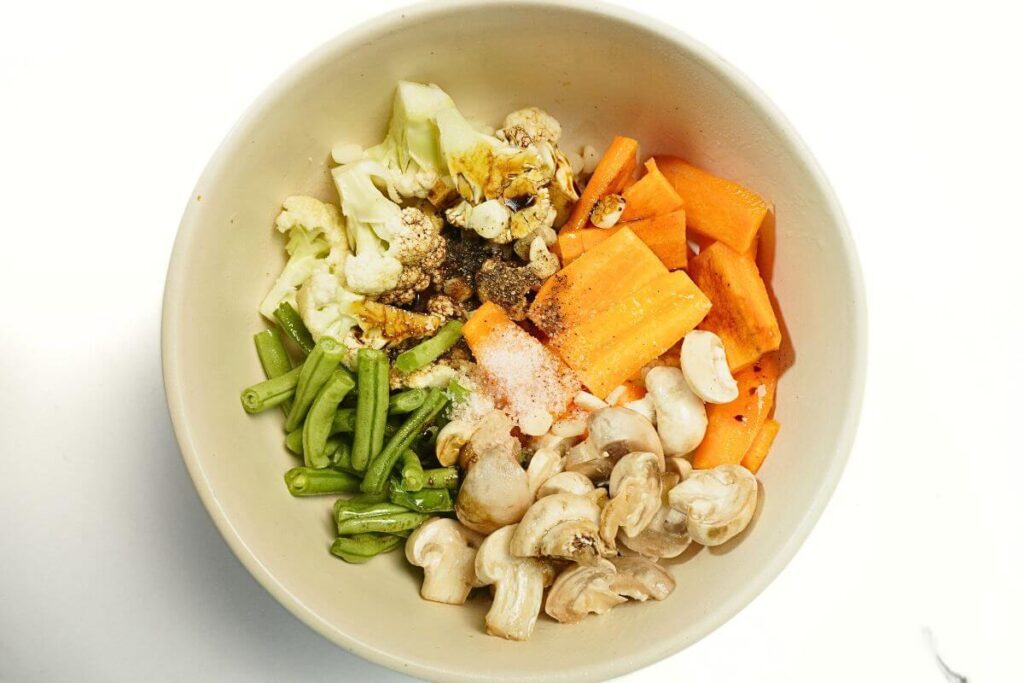 roasted vegetables in air fryer add veggies and spices
