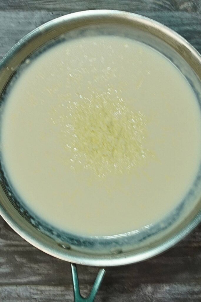 white cheesy pasta add cheese