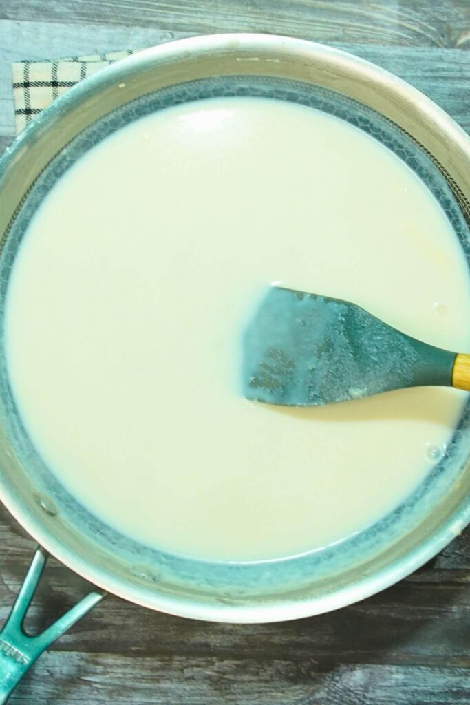 white cheesy pasta add milk